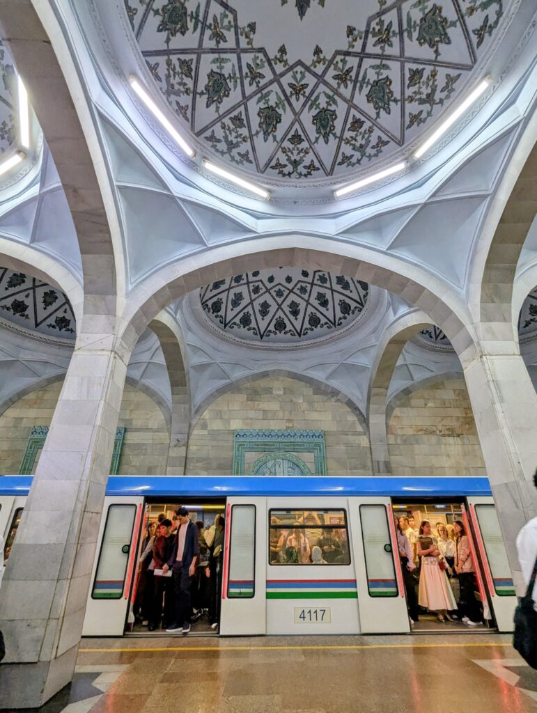 Tashkent Metro ornate arched ceiling Islamic geometric patterns train Uzbekistan
